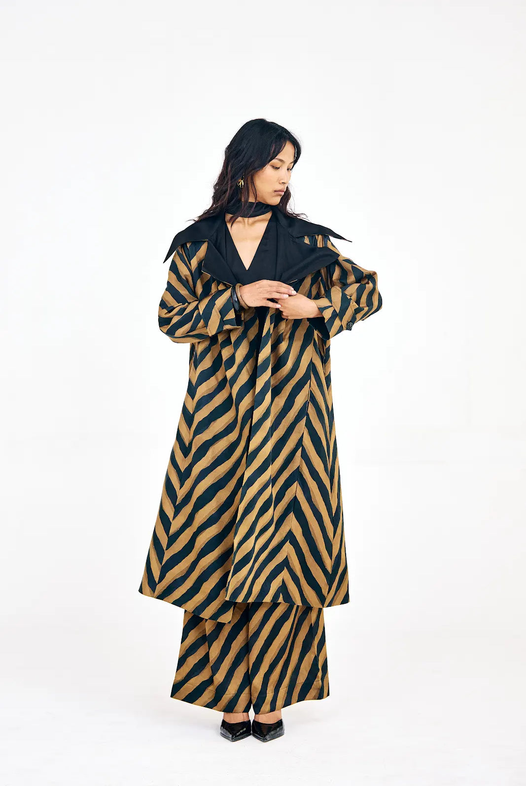 Women’s Verge set featuring long jacket, shift dress, and printed trousers