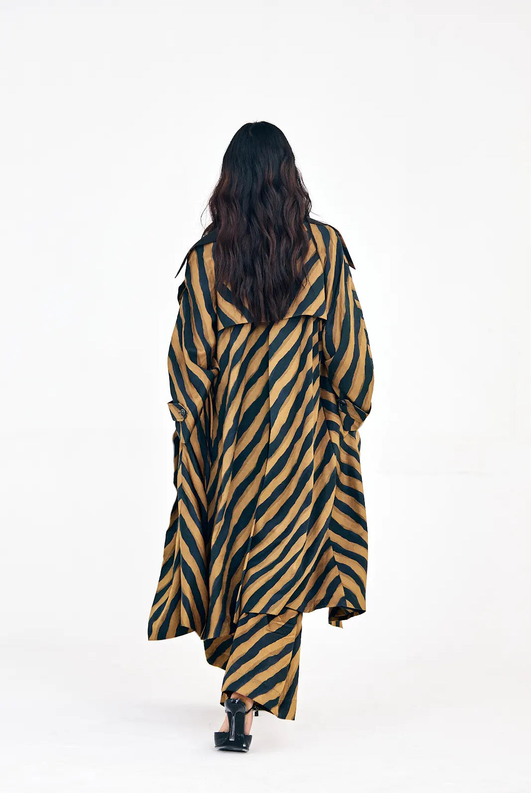 Wide-leg chevron pants paired with V-neck mini dress and trench jacket