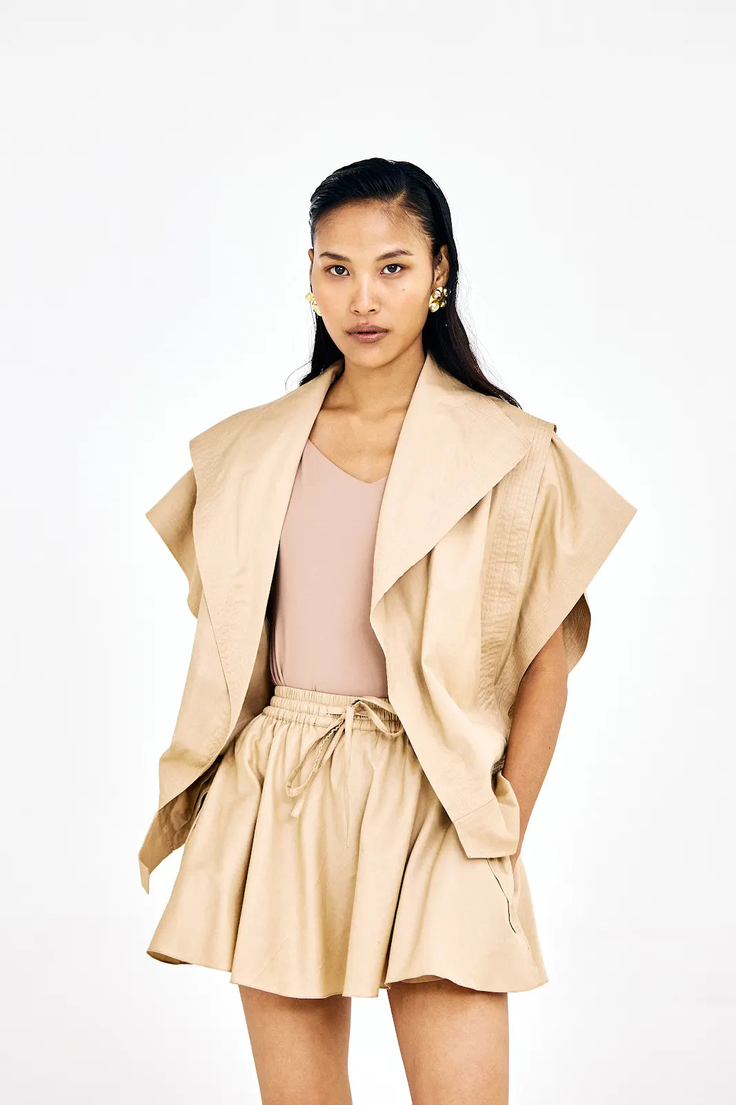 Beige cotton twill co-ord set with asymmetrical jacket and mini skirt