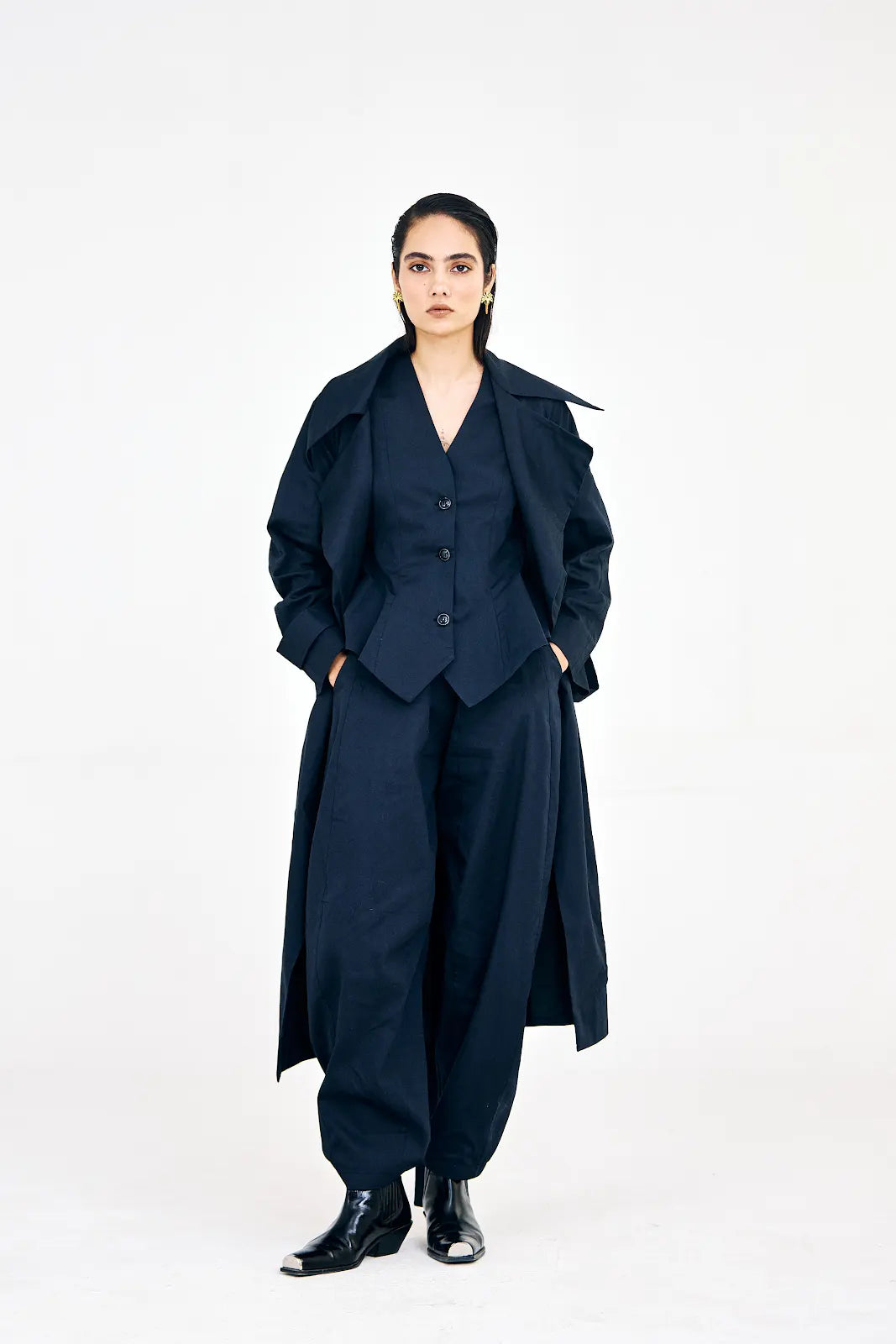 Women’s navy blue cotton twill set featuring elongated-lapel trench coat