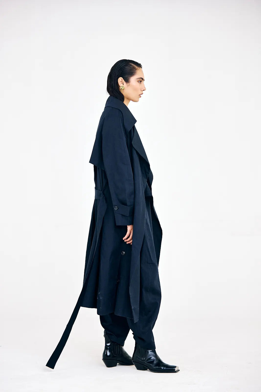 Front view of navy blue fall co-ord set with sharp trench silhouette