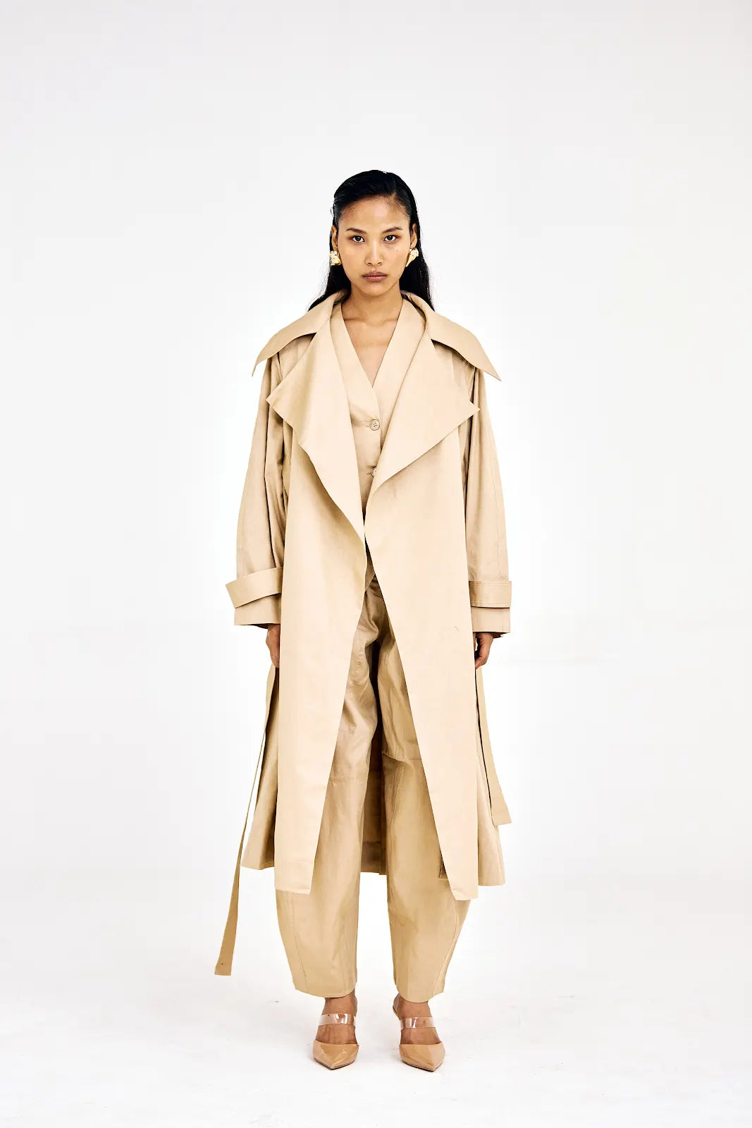 Beige cotton twill three-piece set with trench coat, waistcoat, and barrel pants