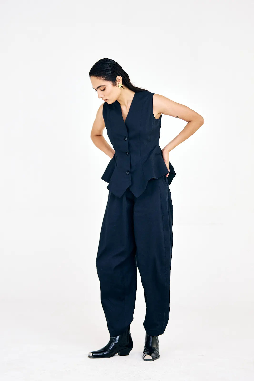 Cinched-waist cotton twill waistcoat paired with structured barrel pants