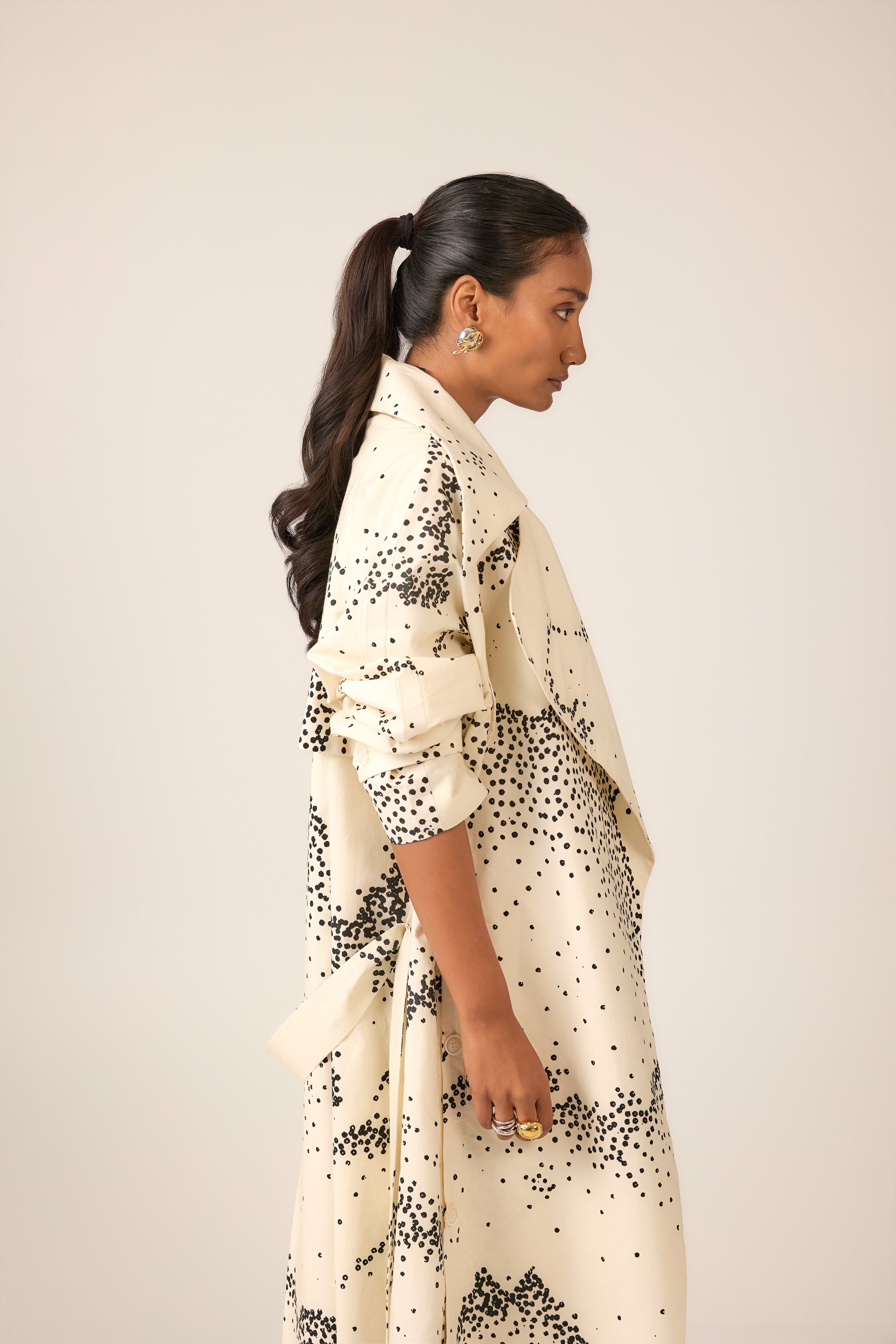 Women’s percale trench with exaggerated lapels and sharp shoulders