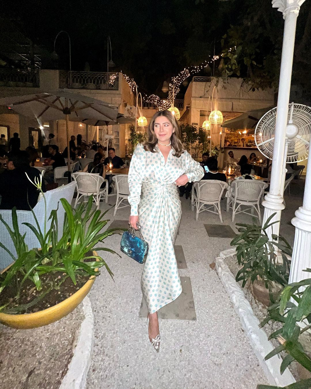 Front view of Jenni shirt paired with Tina sarong skirt