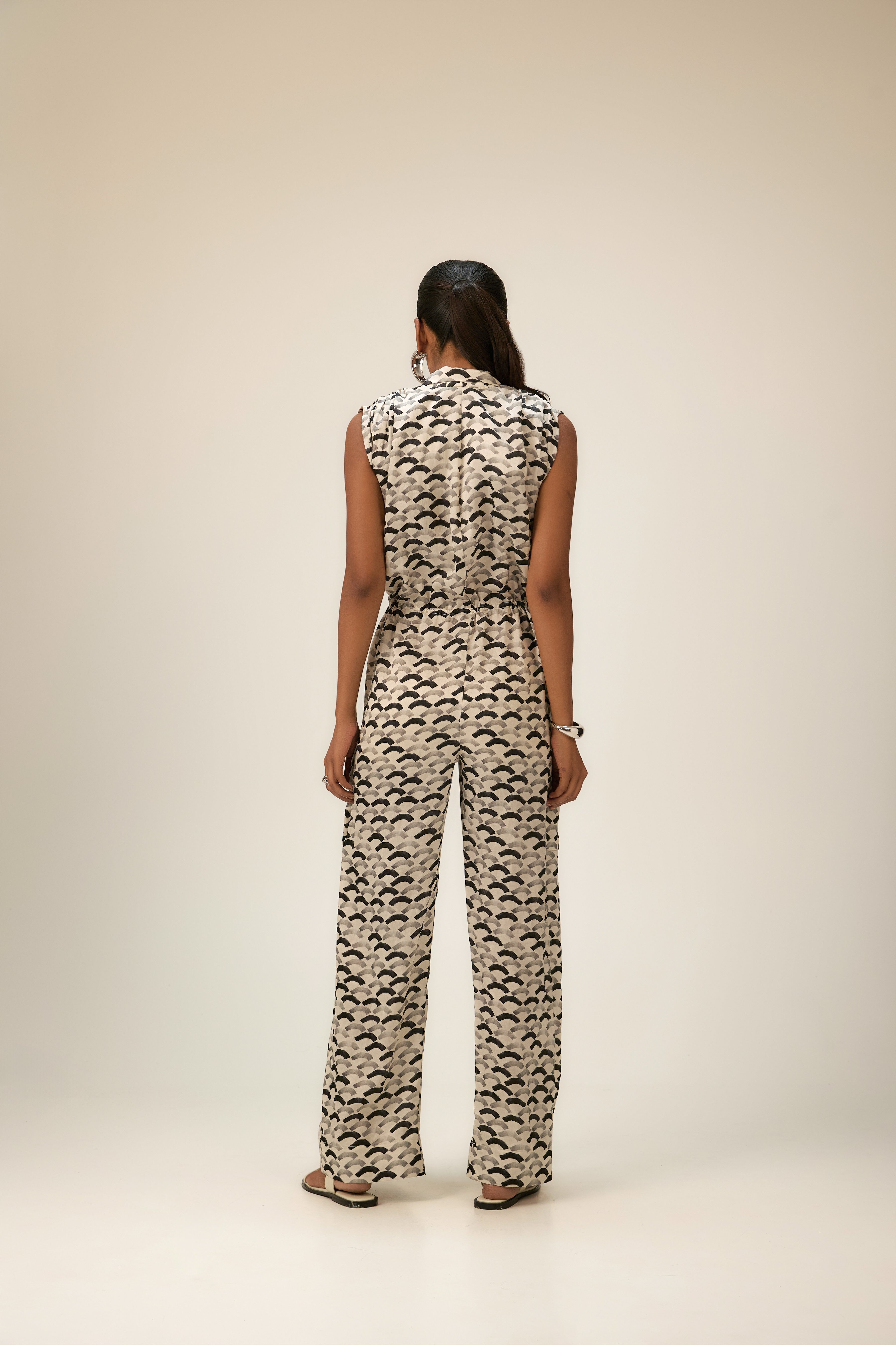 Backside look of girls' jumpsuit party wear designer in luxury
