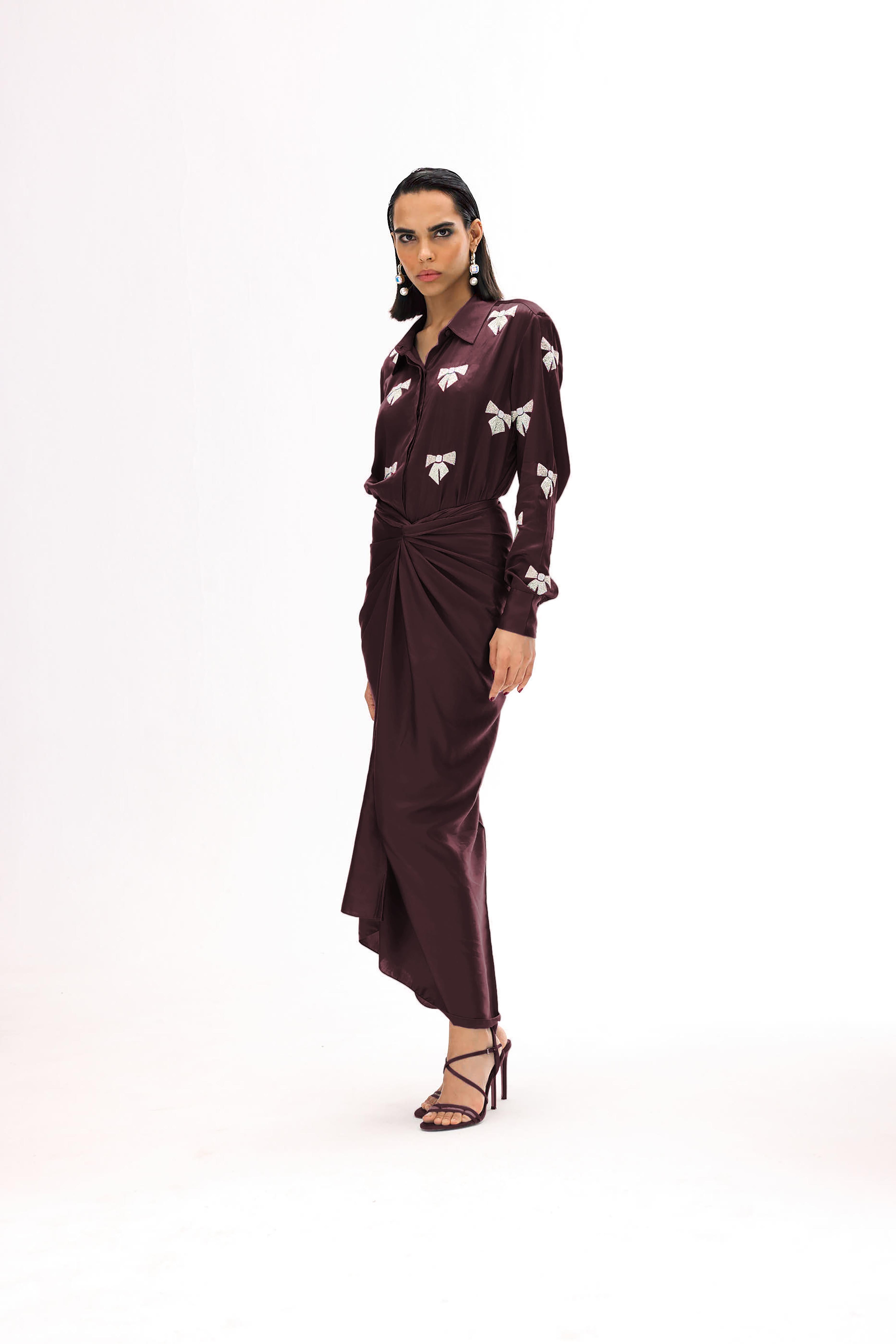 Women’s embroidered shirt paired with elegant draped wrap skirt