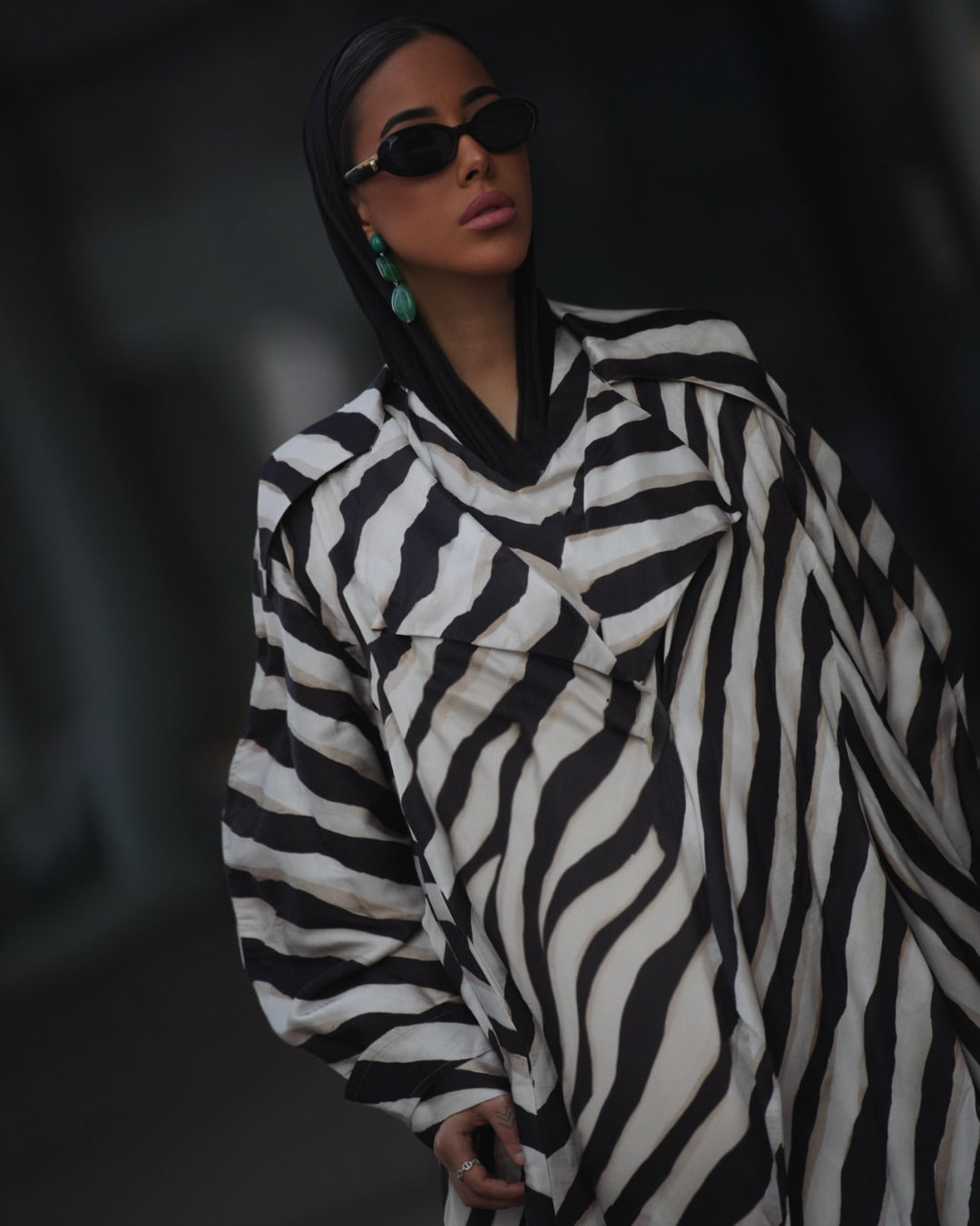 Front view of printed jacket and pants with fluid silhouette