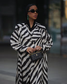 Women’s printed jacket featuring long sleeves and adjustable cuffs